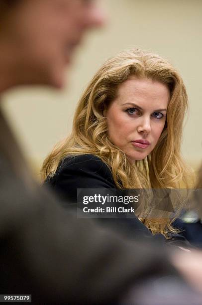 Nicole Kidman, actress and UNIFEM Goodwill ambassador, listens as other witnesses make their opening statements during the House Foreign Affairs...