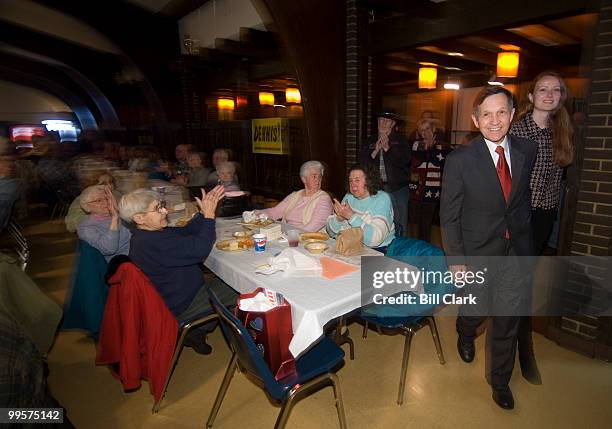 Rep. Dennis Kucinich, D-Ohio, holds hands with his wife Elizabeth as he arrives to deliver a speech at the UAW Local 1250 union hall in Brook Park,...