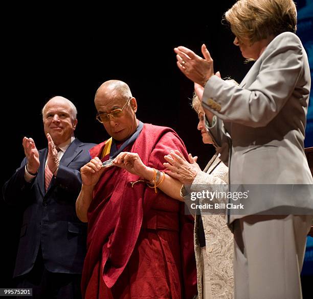 From left, Sen. John McCain, R-Ariz., His Holiness The Dalai Lama, Annette Lantos, widow of Rep. Tom Lantos, and Speaker of the House Nancy Pelosi,...