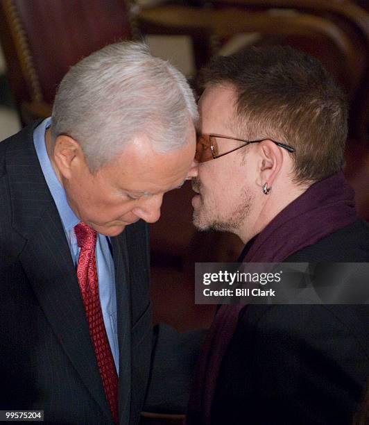 Sen. Orrin Hatch, R-Utah, speaks to U2's Bono after the memorial service for Rep. Tom Lantos, D-Calif., in Statuary Hall in the U.S. Capitol building...