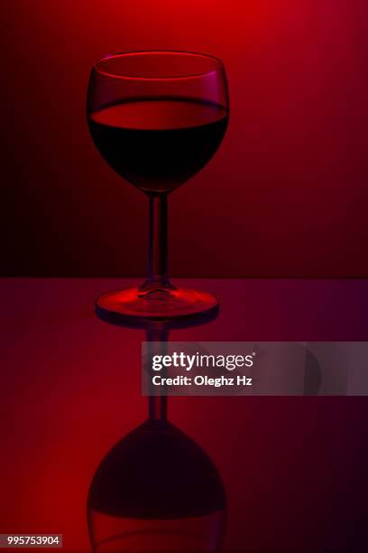 studio still-life with a glass of wine - merlot grape stock pictures, royalty-free photos & images