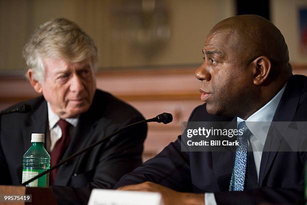 Newsman Ted Koppel, left, talks with Earvin "Magic" Johnson, founder and chairman of the Magic Johnson Foundation, during a panel discussion at the...