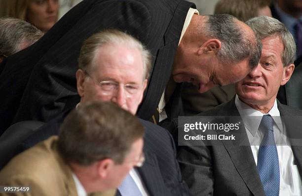 From right, chairman Max Baucus, D-Mont., speaks with Sen. Charles Schumer, D-N.Y., during the Senate Finance Committee's markup of "The America's...