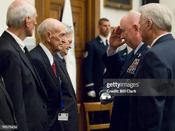 From left, Staff Sgt. Robert Speed, Jr., Tech. Sgt. Jay Fish and 1st Lt. Edward McNally receive their Distinguished Flying Cross medals from Air...