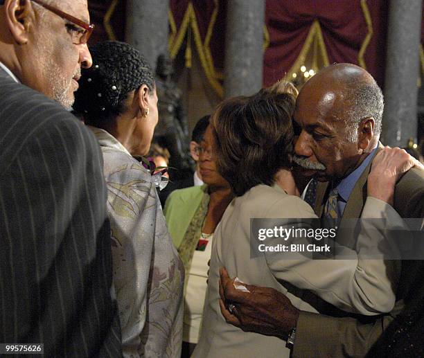 Speaker of the House Nancy Pelosi, D-Calif., hugs James McDonald, Jr., widower of Rep. Juanita Millender-McDonald, at the conclusion of the memorial...