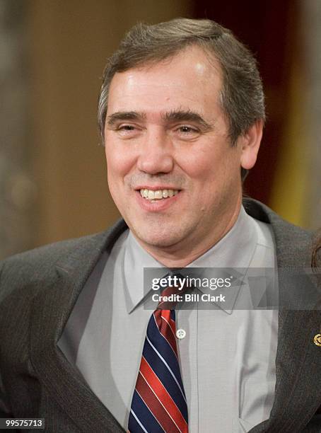 Sen. Jeff Merkley, D-Ore., poses for photos during his mock swearing in ceremony in the Old Senate Chamber on Tuesday, Jan. 6, 2009.