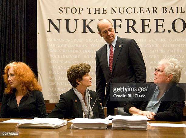 From left, Bonnie Raitt, Rep. Shelley Berkley, D-Nev., Rep. John Hall, D-N.Y., and Graham Nash participate in a news conference on nuclear energy on...