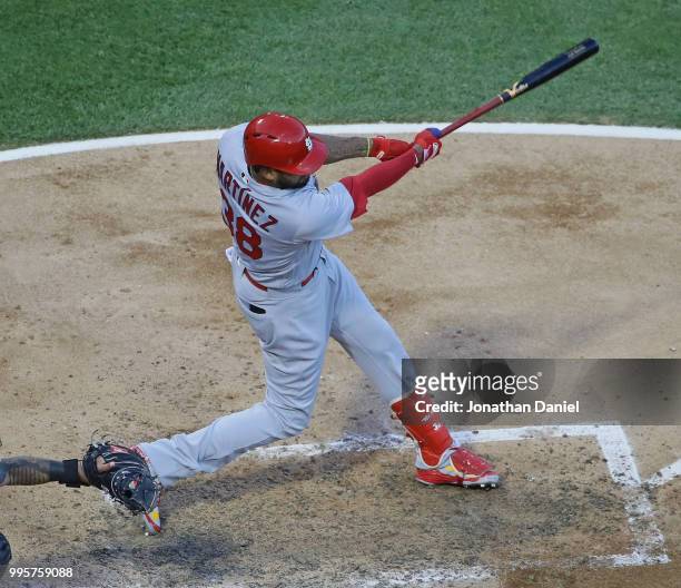 Jose Martinez of the St. Louis Cardinals hits a run scoring single in the 3rd inning against the Chicago White Sox at Guaranteed Rate Field on July...