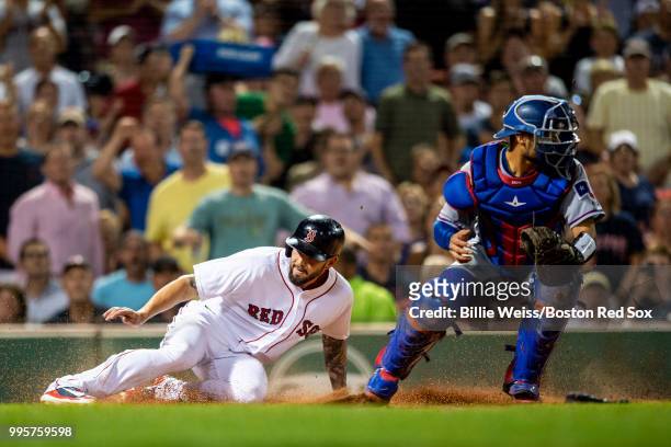 Blake Swihart of the Boston Red Sox evades the tag of Isiah Kiner-Falera of the Texas Rangers as he scores during the sixth inning of a game on July...