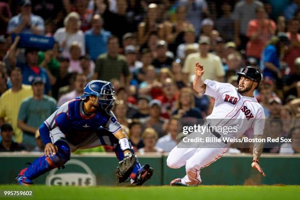 Blake Swihart of the Boston Red Sox evades the tag of Isiah Kiner-Falera of the Texas Rangers as he scores during the sixth inning of a game on July...