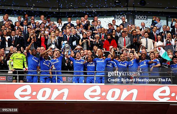 John Terry and Frank Lampard of Chelsea lift the trophy as their team-mates celebrate following victory in the FA Cup sponsored by E.ON Final match...