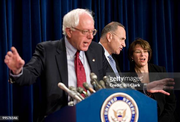 From left, Sen. Bernie Sanders, I-Vt., Sen. Charles Schumer, D-N.Y., and Sen. Amy Klobuchar, D-Minn., participate in a news conference in the Senate...