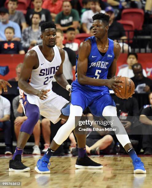 Mohamed Bamba of the Orlando Magic is guarded by Deandre Ayton of the Phoenix Suns during the 2018 NBA Summer League at the Thomas & Mack Center on...