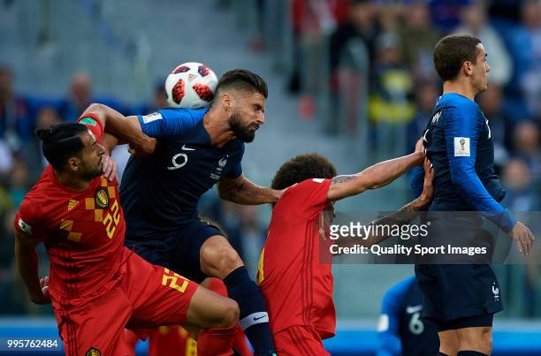 Nacer Chadli of Belgium competes for the ball with Olivier Giroud of France during the 2018 FIFA World Cup Russia Semi Final match between Belgium...