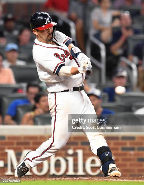 Kurt Suzuki of the Atlanta Braves knocks in a run with a sixth inning single against the Toronto Blue Jays at SunTrust Park on June 26, 2018 in...