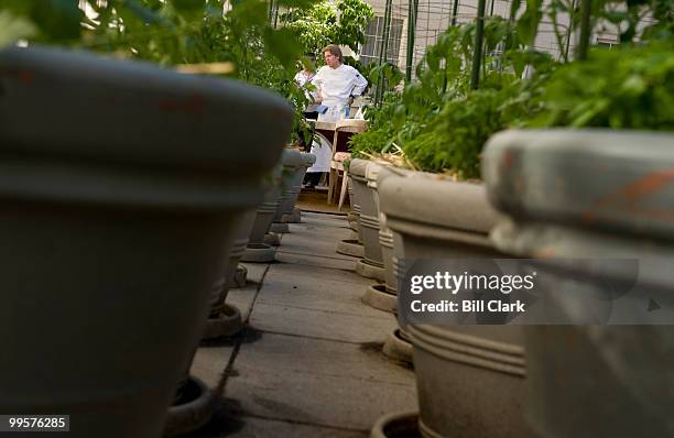 Robert Weland, executive chef at Poste Moderne Brasserie, oversees the setting of the chef's table at the restaurant on Thursday evening, May 21,...