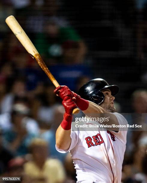 Andrew Benintendi of the Boston Red Sox hits an RBI double during the seventh inning of a game against the Texas Rangers on July 10, 2018 at Fenway...