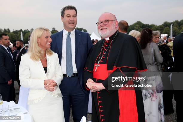 Prime minister of Bavaria Dr. Markus Soeder and his wife Karin Soeder and Kardinal Reinhard Marx during the Summer Reception of the Bavarian State...