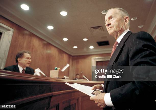 Ross Perot, CEO and Chairman of Perot Systems Corporation, shows a picture and a book to Senators before testifying about Gulf War Illnesses during...