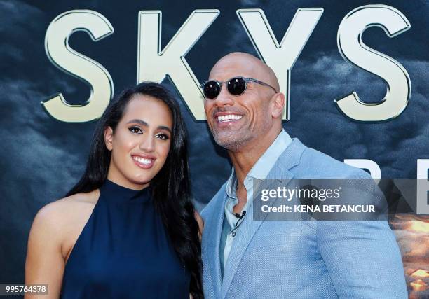 Actor Dwayne Johnson and his daughter Simone Alexandra Johnson attend the premiere of 'Skyscraper' on July 10, 2018 in New York City.