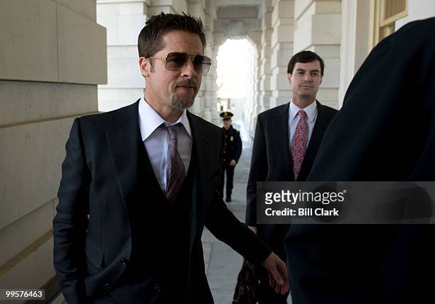 Actor Brad Pitt arrives in the U.S. Capitol to discuss his Make It Right Foundation with Senate Majority Leader Harry Reid on Thursday, March 5,...