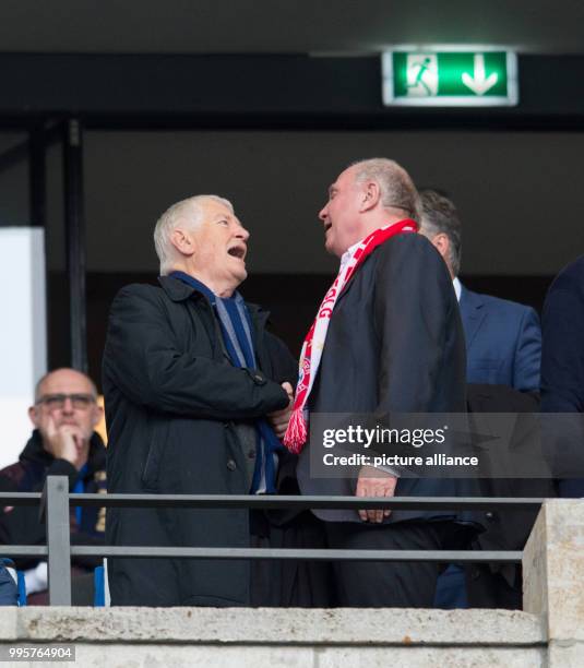 Bayern's president Uli Hoeness greets former SPD politician and minister of interior affairs Otto Schily during the German Bundesliga match between...