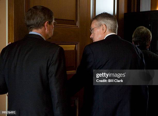 From left, Sen. Kent Conrad, D-N. Dak., and Senate Minority Leader Harry Reid, D-Nev., arrive for the Senate Democratic Policy lunch following the...