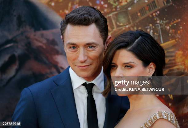 Actress Neve Campbell and her partner actor JJ Field attend the premiere of "Skyscraper" on July 10, 2018 in New York City.