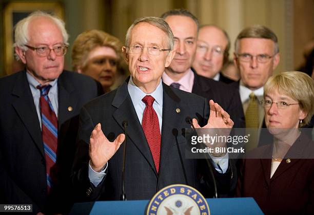 Senate Majority Leader Harry Reid, D-Nev., surrounded from left by , Sen. Bernie Sanders, I-Vt., Sen. Debbie Stabenow, D-Mich., Sen. Charles Schumer,...