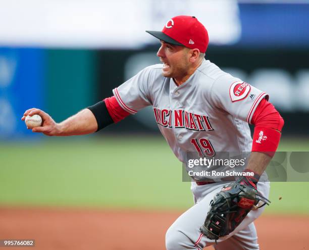 Joey Votto of the Cincinnati Reds runs to first base to force out Greg Allen of the Cleveland Indians during the fifth inning at Progressive Field on...