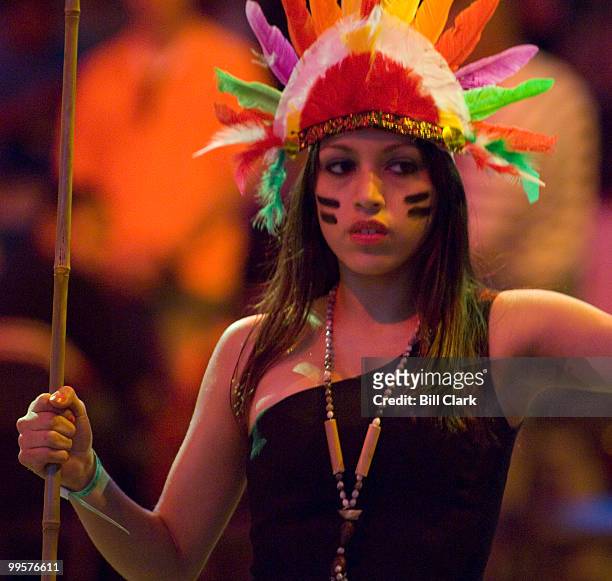 An dancer with the group Inca Son, of Peru, performs during their War Dance presentation on the floor of the Verizon Center in Washington as the...