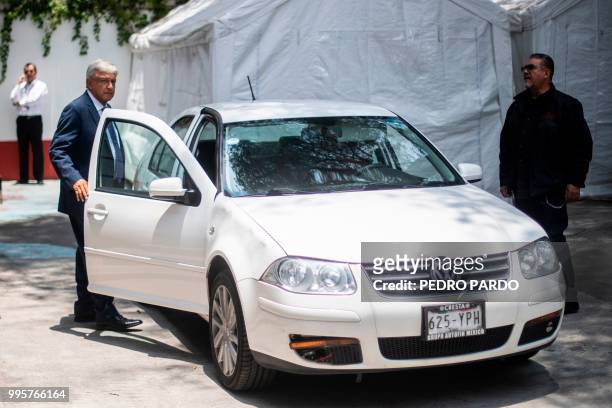 Mexico's President-elect Andres Manuel Lopez Obrador enters his car as he prepares to leave the party's headquarters in Mexico City on July 9, 2018....