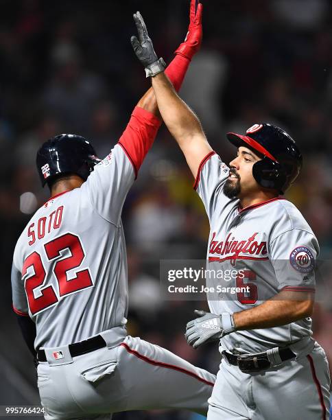 Anthony Rendon of the Washington Nationals celebrates his two-run home run with Juan Soto during the fifth inning against the Pittsburgh Pirates at...