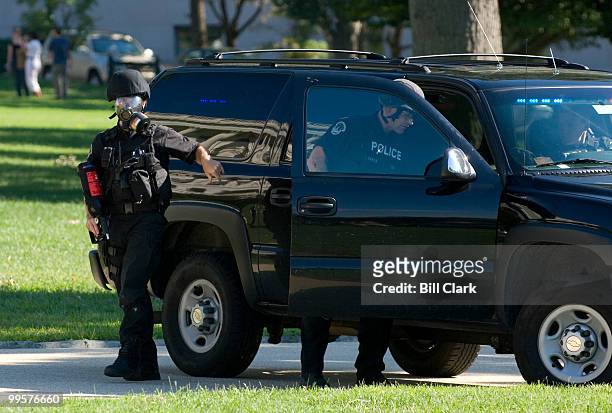 Capitol Police armed with pepper spray and tear gas launchers arrive guard the West Front of the Capitol during the anti-war protest on Saturday,...