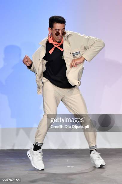 Model dances on the runway at the Gustav Von Aschenbach fashion show during July 2018 New York City Men's Fashion Week at Industria Studios on July...