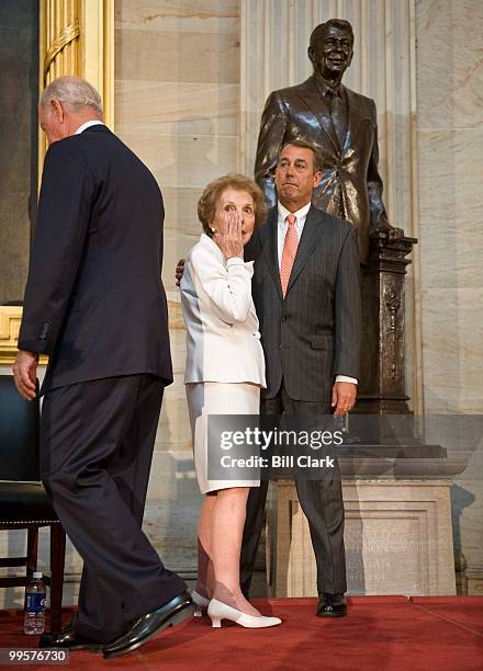 Former First Lady Nancy Reagan wipes away a tear as House Minority Leader John Boehner, R-Ohio, comforts her during the ceremony to unveil a statue...