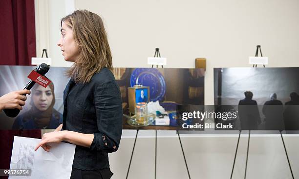 Photographer Gabriela Bulisova is interviewed by Al Hurra TV about her photos of Iraqi refugees at the exhibit in the Rayburn House Office Building...