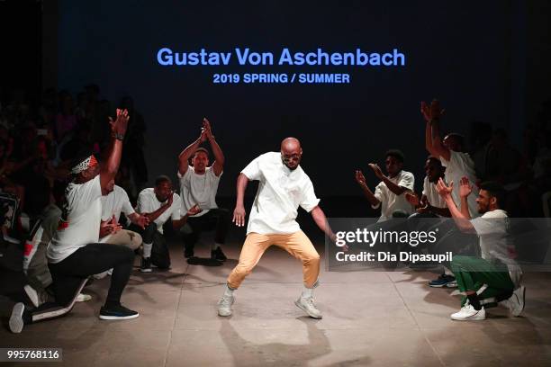 Models dance on the runway at the Gustav Von Aschenbach fashion show during July 2018 New York City Men's Fashion Week at Industria Studios on July...