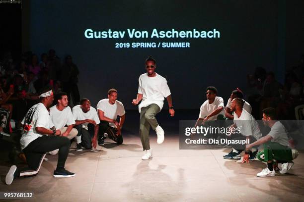 Models dance on the runway at the Gustav Von Aschenbach fashion show during July 2018 New York City Men's Fashion Week at Industria Studios on July...