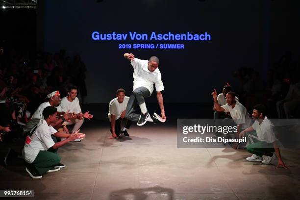 Models dance on the runway at the Gustav Von Aschenbach fashion show during July 2018 New York City Men's Fashion Week at Industria Studios on July...