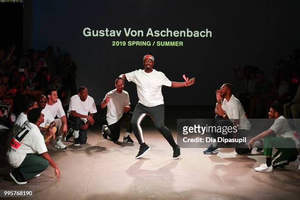 Models dance on the runway at the Gustav Von Aschenbach fashion show during July 2018 New York City Men's Fashion Week at Industria Studios on July...