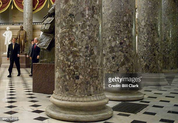 From left, House Minority Leader John Boehner, R-Ohio, Rep. Paul Ryan, R-Wisc., and Rep. Mike Pence, R-Ind., walk through Statuary Hall on their way...