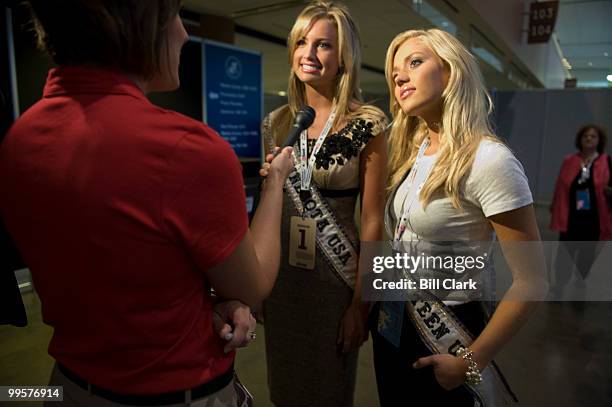 Miss Minnesota USA Kaylee Unverzagt, left and Miss Minnesota Teen USA Sarah Sprayberry speak to a television news crew on the concourse of the of the...