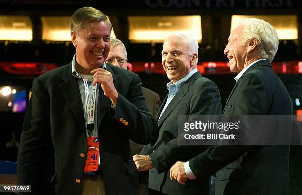 From left, Sen. Lindsey Graham, R-S.C., Republican presidential candidate Sen. John McCain, R-Ariz., and Sen. Joe Lieberman, I-Conn., laugh on stage...