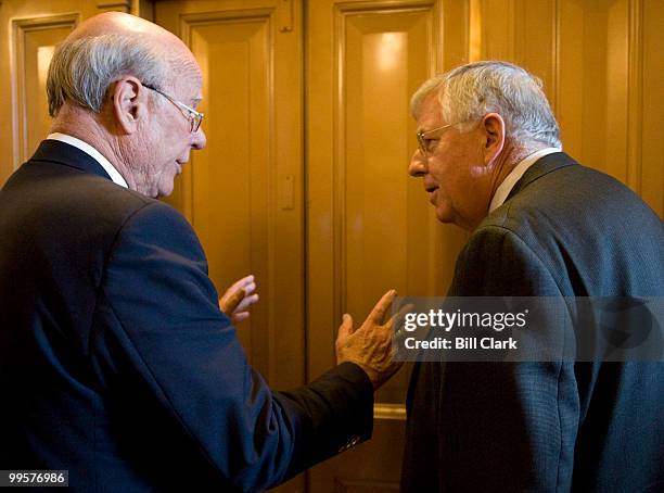 Sen. Pat Roberts, R-Kansas, left, speaks with Sen. Michael Enzi, R-Wyo., as they wait for their elevator following a vote on the Senate Floor on...