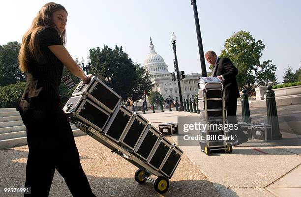 Michelle Moody, and her father Kevin Moody, deliver Vaultz boxes to the members of the Senate Commerce, Science and Transportation Committee on...