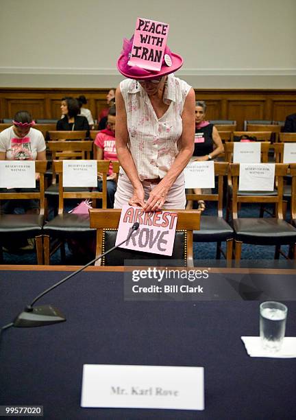 CodePink protesters wait for the former White House Deputy Chief of Staff Karl Rove to testify during the House Judiciary Committee's Commercial and...