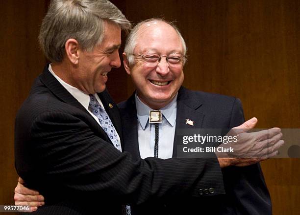 Sen. Mark Udall, D-Colo., left, welcomes Interior Secretary Ken Salazar to the Senate Energy and Natural Resources Committee for the hearing on...