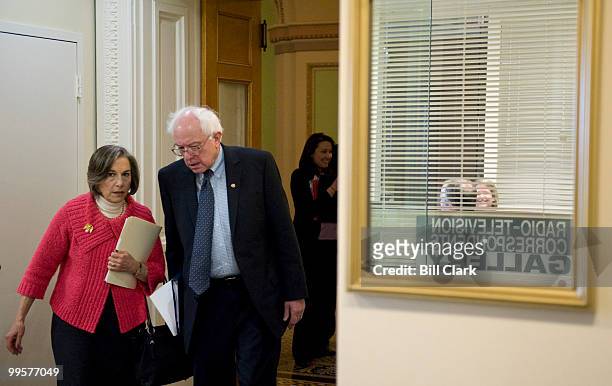 Rep. Janice Schakowsky, D-Ill., and Sen. Bernie Sanders, I-Vt., arrive for their news conference on defense contractors on Tuesday, Feb. 23 in the...
