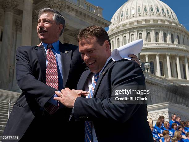 Rep. John Salazar, D-Colo., left, jokes with Rep. Heath Shuler, D-N.C., on the steps of the U.S. Capitol on Tuesday, March 31. 2009. Shuler was...